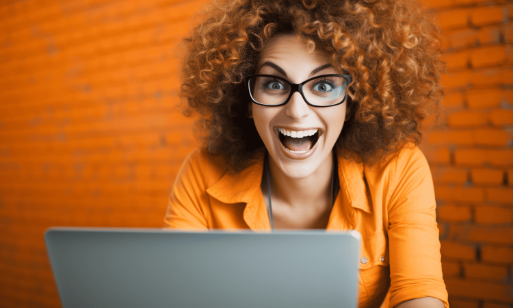 comical_photograph_excited_woman_working_on_laptop An exuberant woman on her laptop who has an unhealthy love affair with Microsoft Excel
